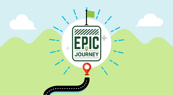 Illustration of a curved road leading to a sign reading "Epic Journey" with a green flag atop. Background features green hills and white clouds.