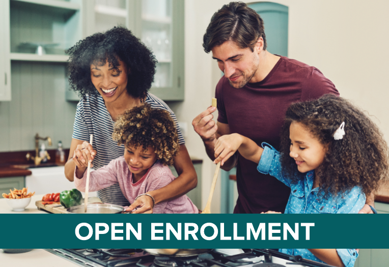 A joyful family cooking together in a bright kitchen. Parents and children smile while stirring a pot. "Open Enrollment" text is overlaid in bold.