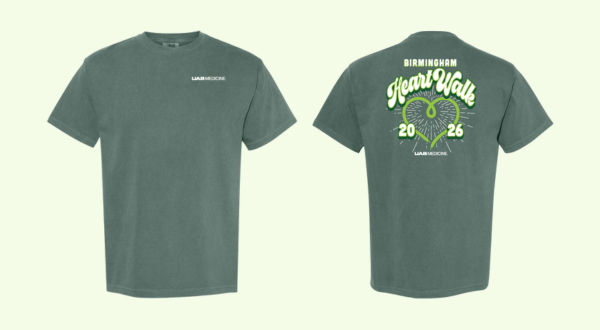 Dark green T-shirt with "UAB Medicine" logo on the front. Back design features "Birmingham Heart Walk 2026" with a heart shape and footprints.